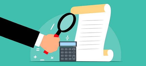 Calculator and document under magnifying glass